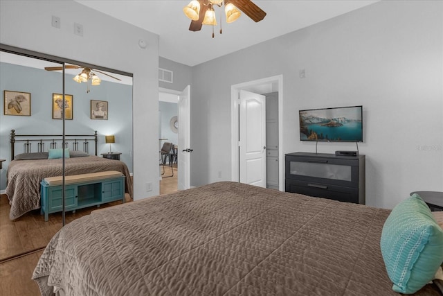 bedroom featuring wood-type flooring and ceiling fan