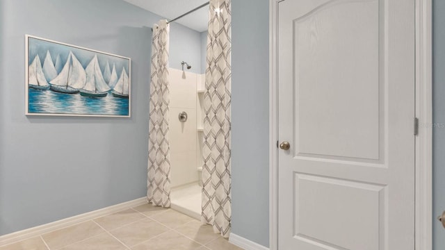 bathroom featuring walk in shower and tile patterned floors