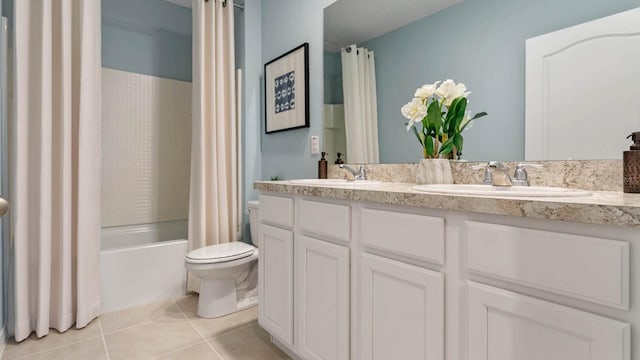 full bathroom featuring shower / bath combo, toilet, vanity, and tile patterned floors