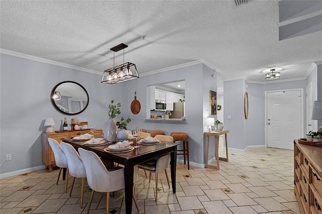 dining room with a textured ceiling and crown molding