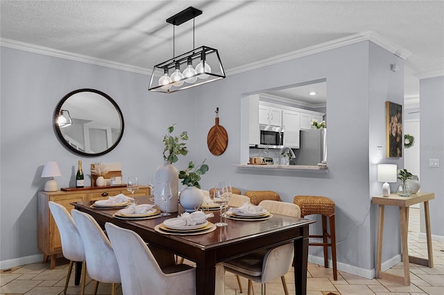 dining space with a textured ceiling and ornamental molding