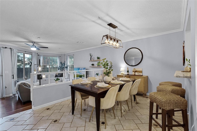 dining room with ornamental molding, a textured ceiling, ceiling fan, and light hardwood / wood-style flooring