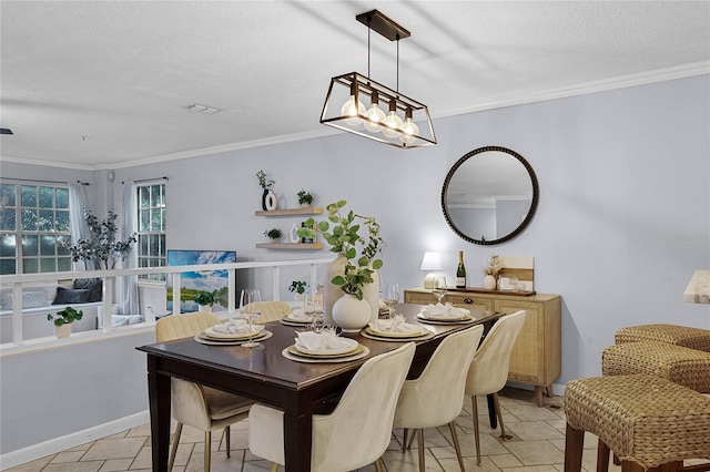 dining space with a textured ceiling and crown molding