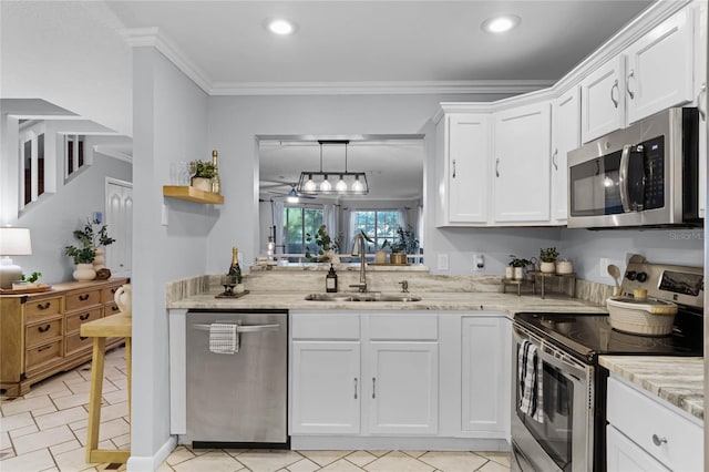 kitchen featuring stainless steel appliances, sink, light stone counters, crown molding, and white cabinets