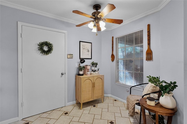 foyer entrance featuring ceiling fan and crown molding