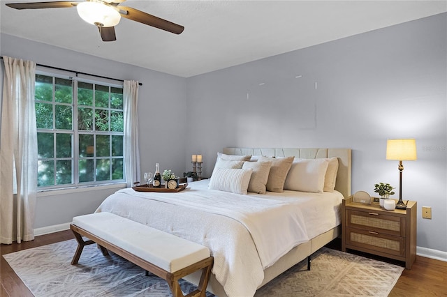 bedroom with wood-type flooring and ceiling fan