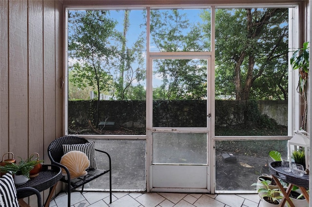 sunroom / solarium featuring a wealth of natural light