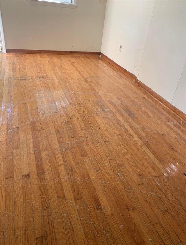 spare room featuring light hardwood / wood-style flooring