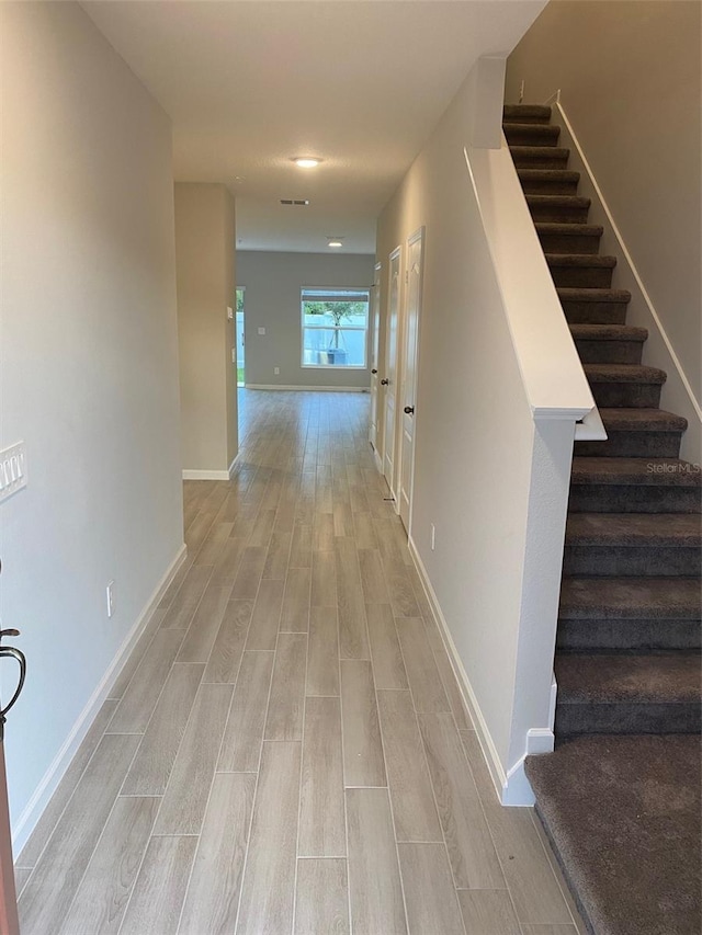 hallway featuring light hardwood / wood-style flooring