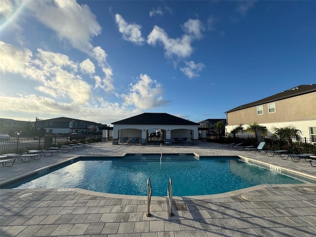 view of swimming pool featuring a gazebo and a patio area