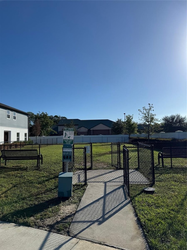 view of property's community featuring a lawn