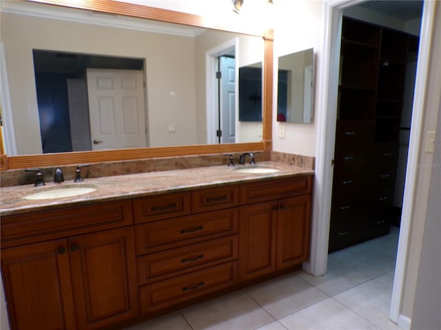 bathroom featuring crown molding, vanity, and tile patterned floors