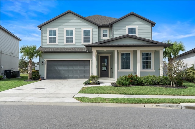 view of front of home featuring a garage and a front yard