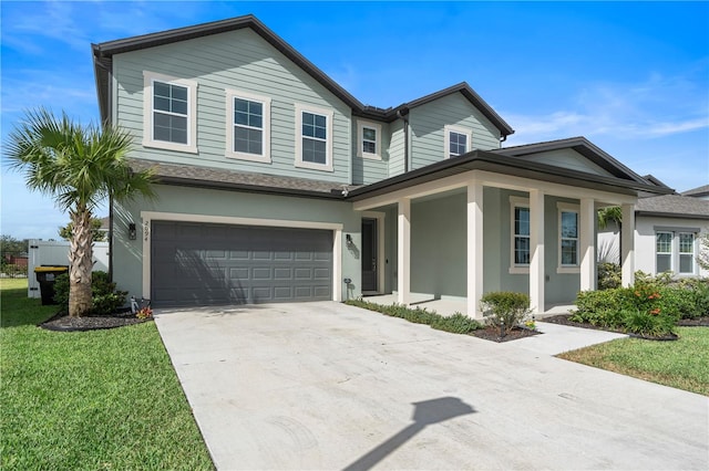 view of front of house featuring a garage and a front yard