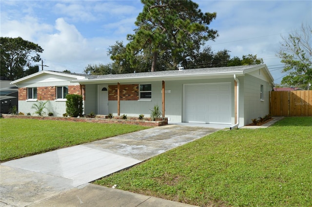 ranch-style house featuring a garage and a front yard