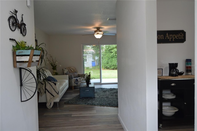 hallway with hardwood / wood-style floors