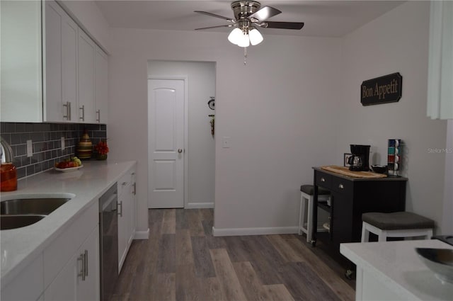 kitchen featuring tasteful backsplash, ceiling fan, dark hardwood / wood-style floors, white cabinets, and dishwasher