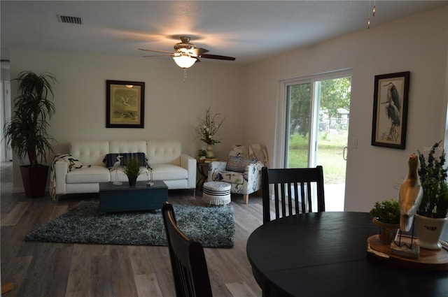 living room with hardwood / wood-style floors and ceiling fan