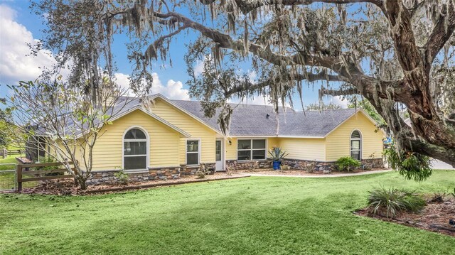 rear view of house with a lawn