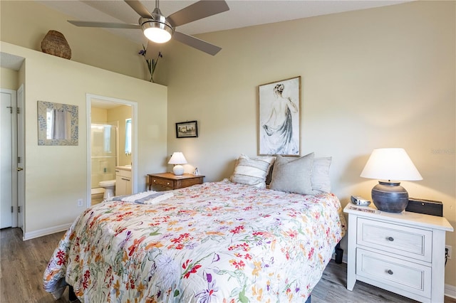 bedroom featuring dark wood-type flooring, connected bathroom, and ceiling fan