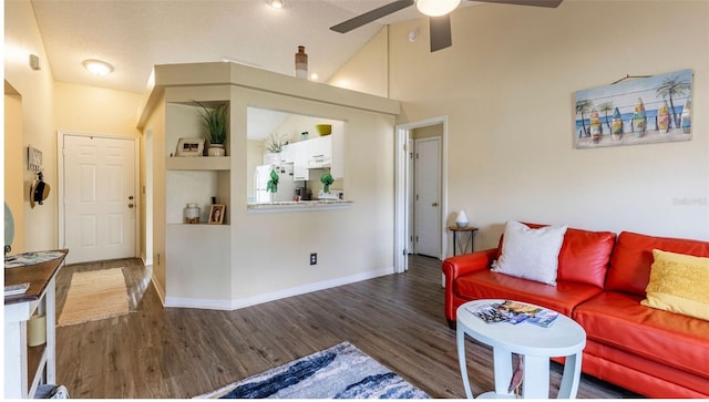 living room featuring ceiling fan, high vaulted ceiling, and dark hardwood / wood-style flooring