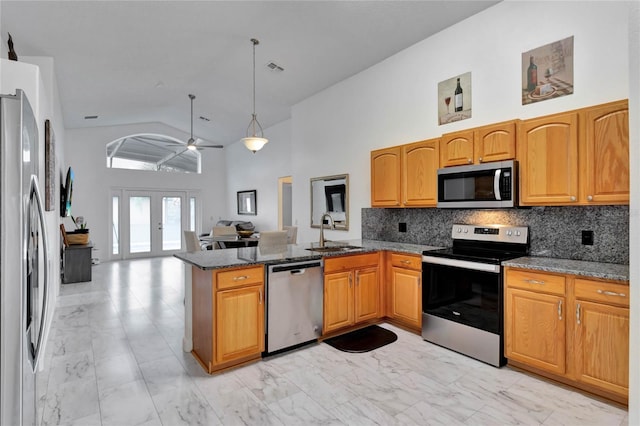 kitchen featuring stainless steel appliances, kitchen peninsula, sink, high vaulted ceiling, and ceiling fan