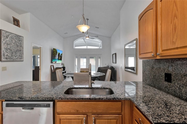 kitchen with french doors, hanging light fixtures, sink, vaulted ceiling, and dishwasher