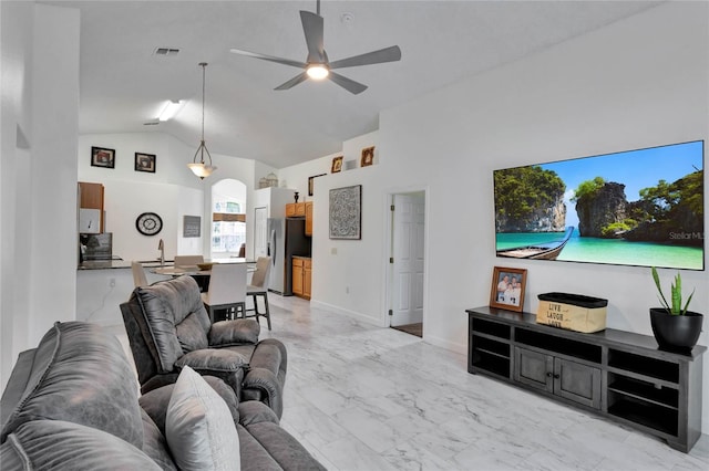 living room with high vaulted ceiling, sink, and ceiling fan