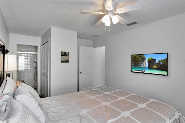 bedroom featuring a closet, a textured ceiling, and ceiling fan