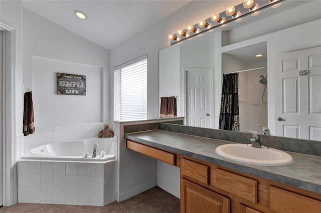 bathroom with vanity, tile patterned floors, plus walk in shower, and vaulted ceiling