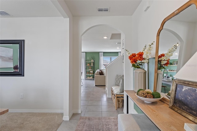 hall with light tile patterned flooring