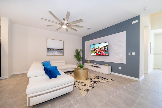 tiled living room featuring ceiling fan