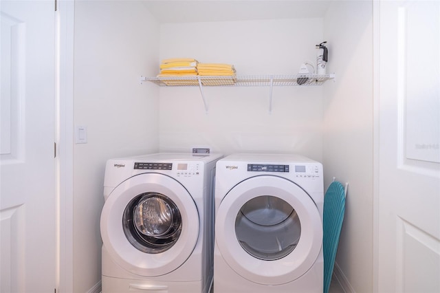 laundry area featuring washing machine and dryer