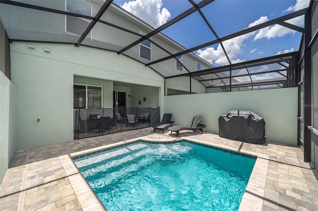 view of pool featuring a lanai and a patio