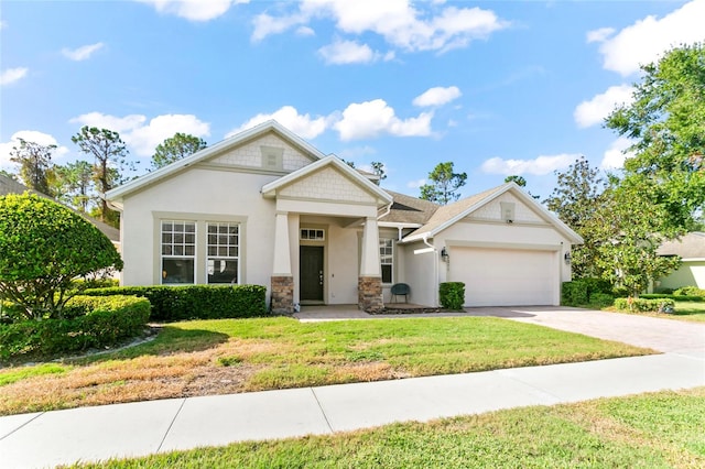 view of front of property with a garage and a front lawn