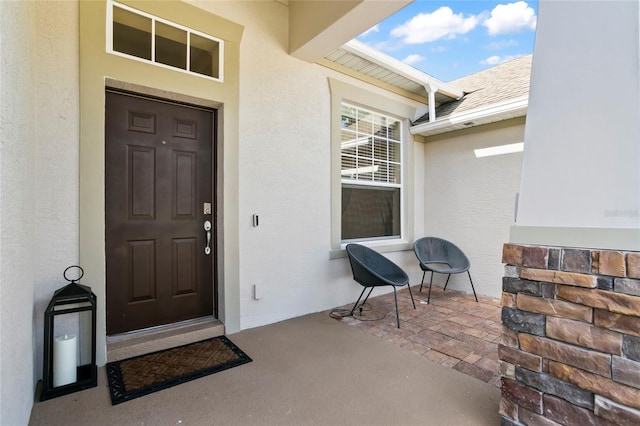 property entrance with a patio area