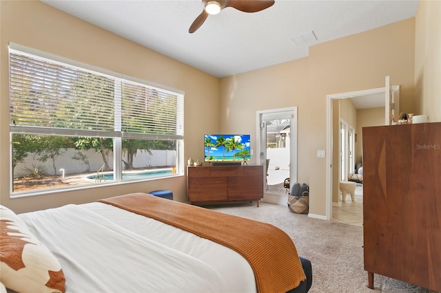 carpeted bedroom with multiple windows and ceiling fan