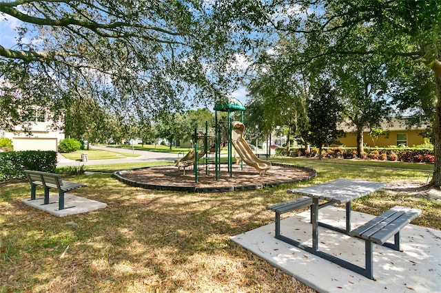 view of playground with a yard