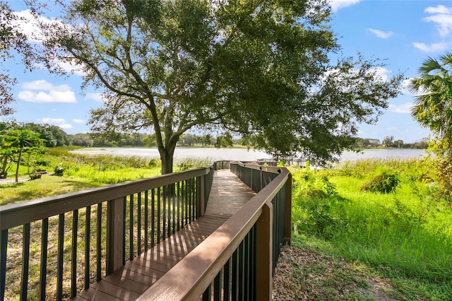 surrounding community featuring a water view