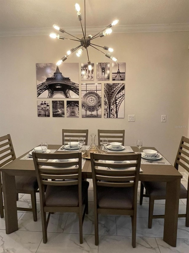 dining room featuring crown molding and a chandelier