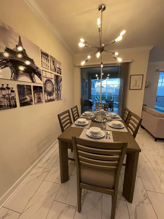 1144 Challenge Dr, Davenport, FL 33896 - dining space featuring light marble finish floors, a chandelier, ornamental molding, and baseboards