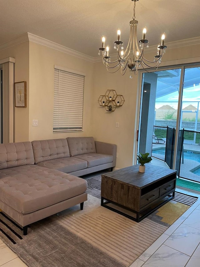 living room with ornamental molding, a textured ceiling, and a chandelier