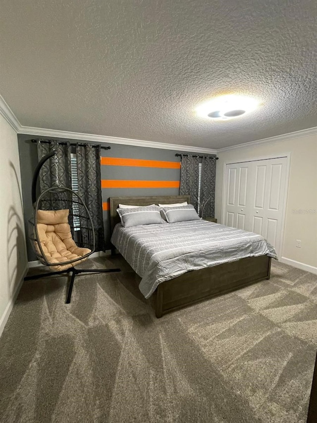 bedroom with carpet flooring, a textured ceiling, a closet, and crown molding