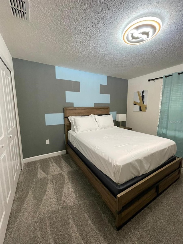 1144 Challenge Dr, Davenport, FL 33896 - carpeted bedroom with a textured ceiling and baseboards