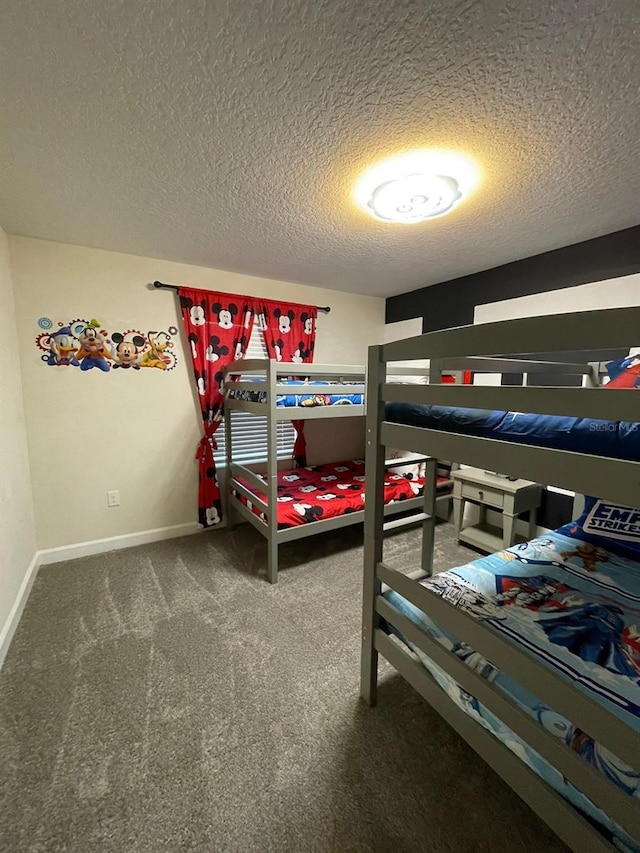 carpeted bedroom featuring a textured ceiling