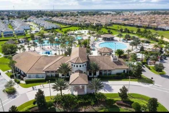 1144 Challenge Dr, Davenport, FL 33896 - aerial perspective of suburban area with a pool