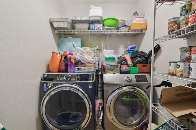 clothes washing area with independent washer and dryer