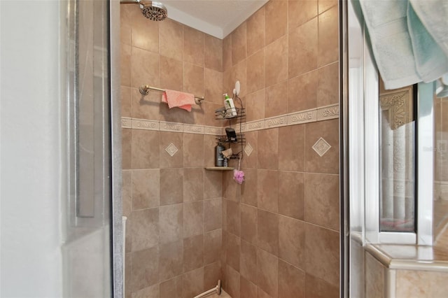 bathroom with tiled shower