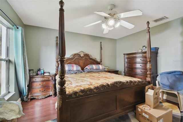 bedroom with wood-type flooring and ceiling fan