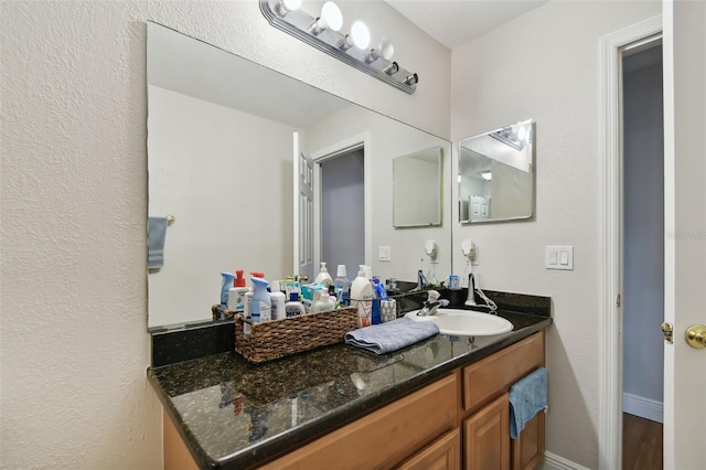 bathroom featuring vanity and wood-type flooring